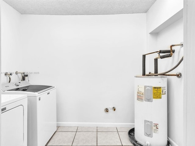 laundry room featuring separate washer and dryer, light tile patterned floors, a textured ceiling, and water heater