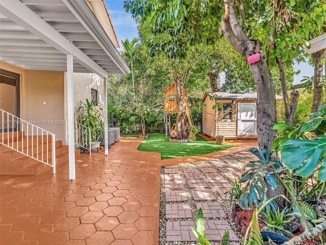 view of patio / terrace featuring a shed