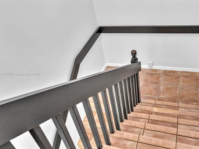 staircase with tile patterned floors