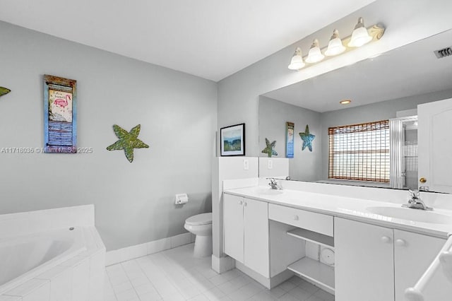 bathroom featuring tile patterned floors, vanity, a relaxing tiled tub, and toilet