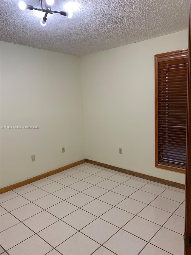 empty room featuring a textured ceiling