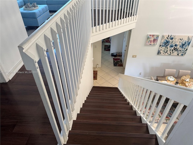 stairway featuring tile patterned floors