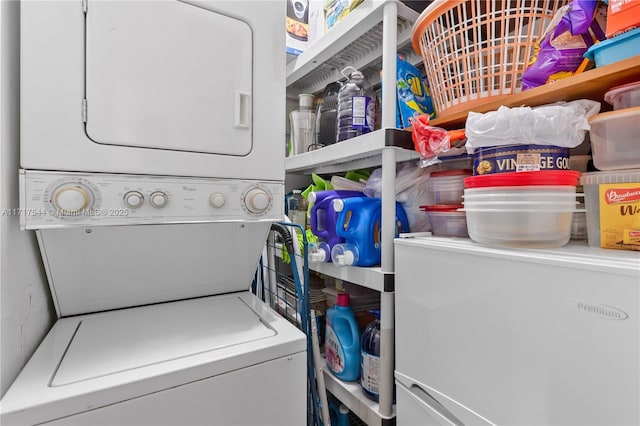 laundry room featuring stacked washer and clothes dryer