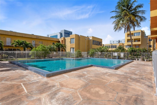 view of swimming pool with a patio area