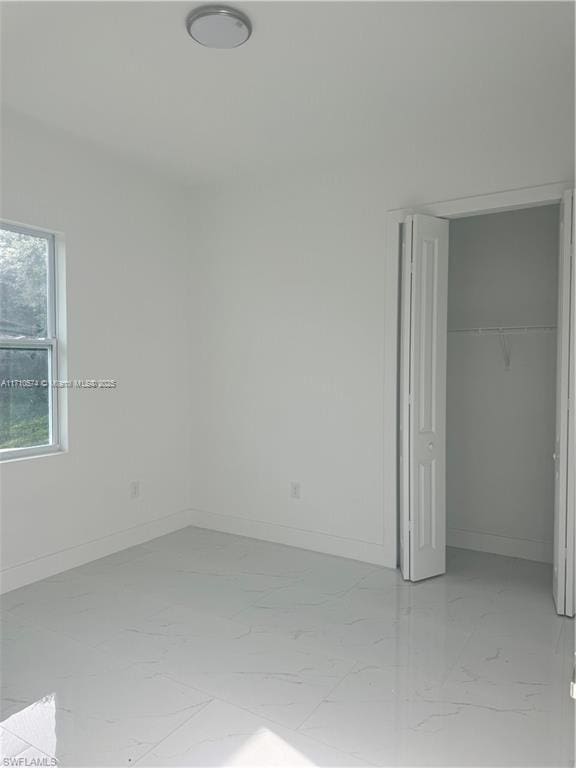 unfurnished bedroom with a closet