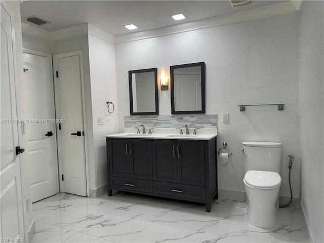 bathroom featuring decorative backsplash, vanity, toilet, and ornamental molding