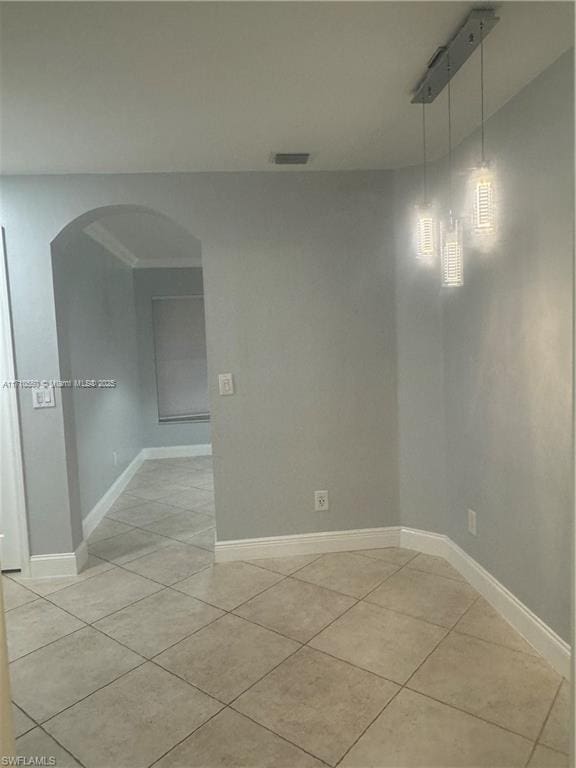 empty room featuring light tile patterned floors