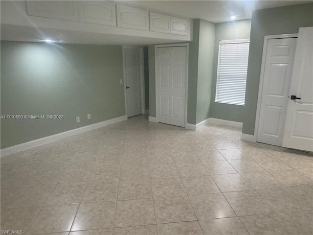 empty room featuring light tile patterned floors