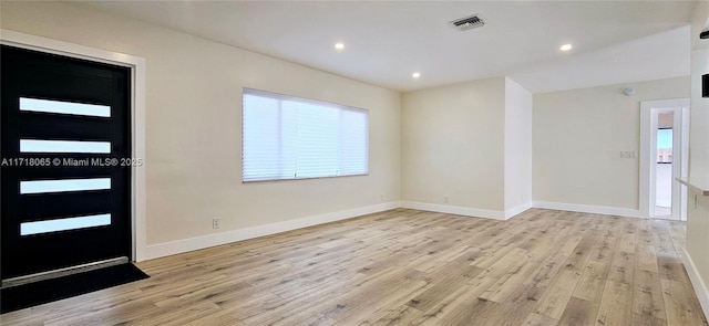 entryway with light hardwood / wood-style floors