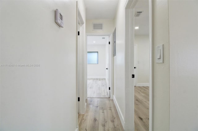 hall with light hardwood / wood-style flooring