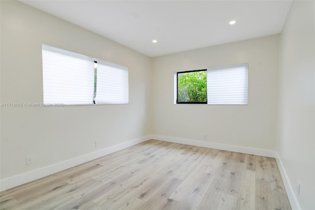 unfurnished room featuring light hardwood / wood-style floors