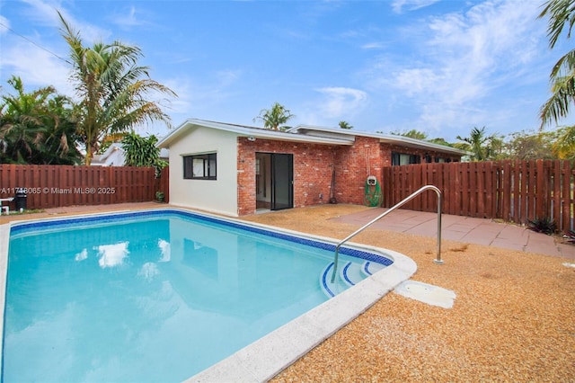 view of pool featuring a patio