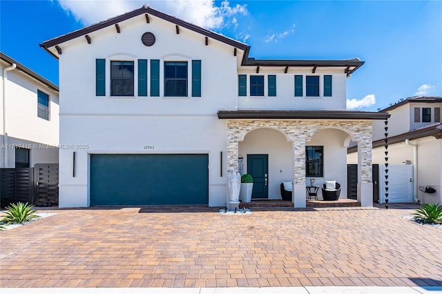 view of front of house with a porch and a garage