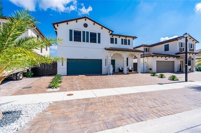 mediterranean / spanish-style house featuring a garage