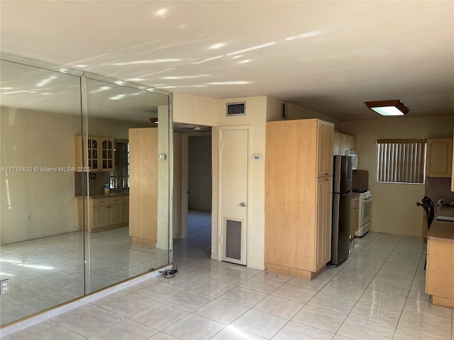 interior space featuring light tile patterned flooring