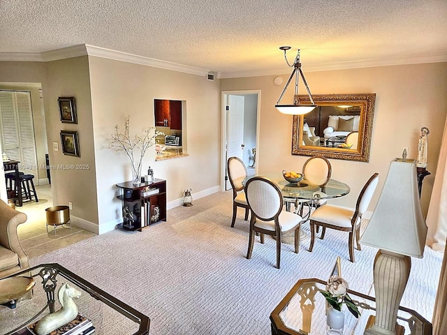 carpeted dining room featuring crown molding and a textured ceiling