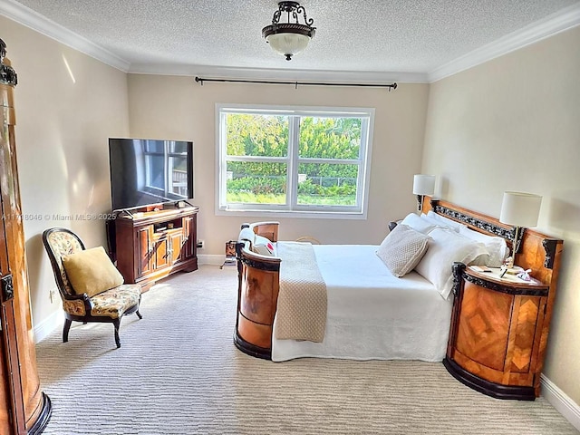 carpeted bedroom with ornamental molding and a textured ceiling