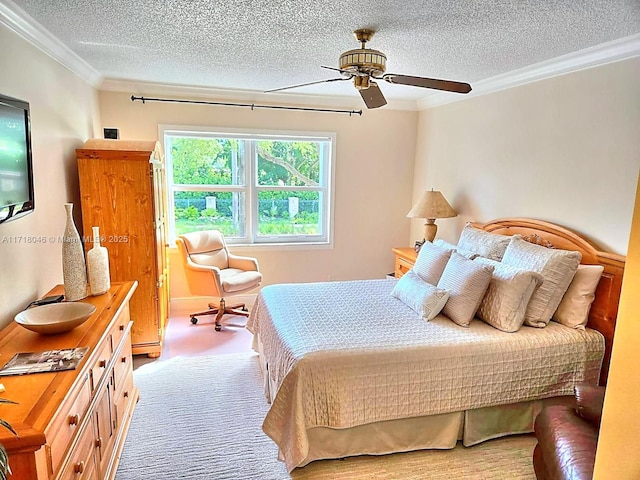 carpeted bedroom featuring crown molding, ceiling fan, and a textured ceiling