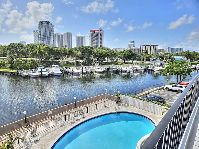 view of pool featuring a water view