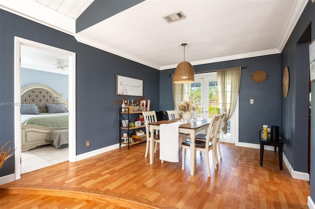 dining room featuring ceiling fan, ornamental molding, and hardwood / wood-style flooring