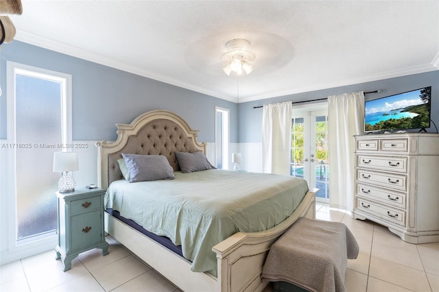 bedroom with ceiling fan, light tile patterned floors, ornamental molding, and access to outside