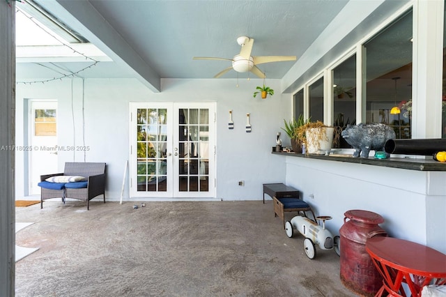 view of patio featuring ceiling fan and french doors