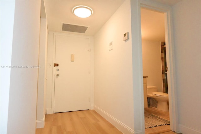 corridor featuring light hardwood / wood-style floors