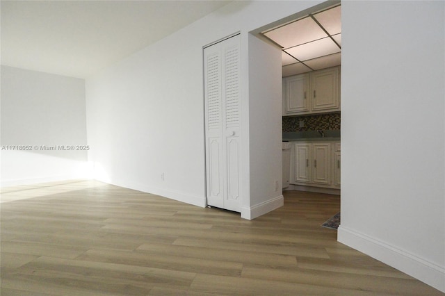 hallway with light wood-type flooring