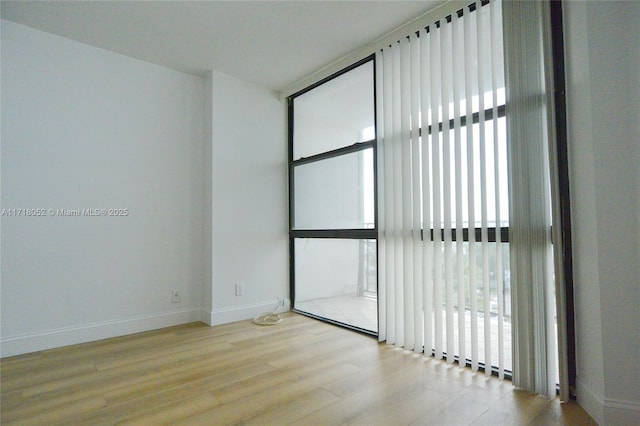 spare room featuring light hardwood / wood-style flooring