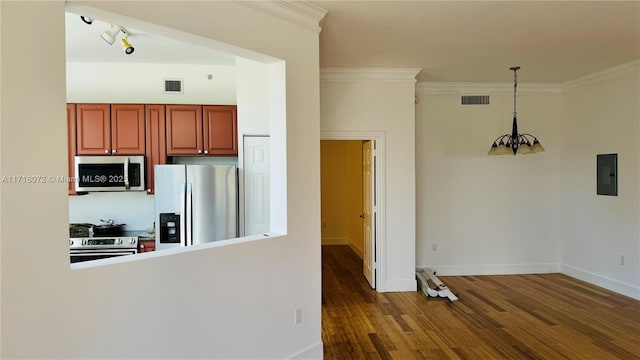 kitchen featuring ornamental molding, stainless steel appliances, pendant lighting, a notable chandelier, and electric panel