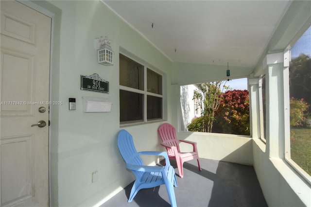 sunroom featuring lofted ceiling