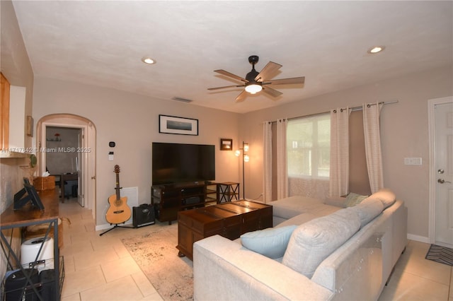 living room featuring ceiling fan and light tile patterned floors