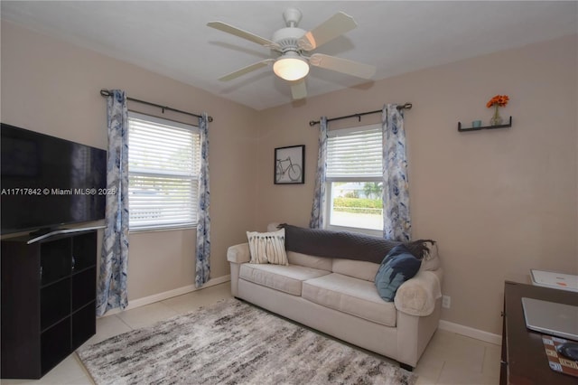 tiled living room featuring ceiling fan