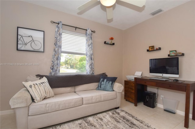 living room with light tile patterned floors and ceiling fan