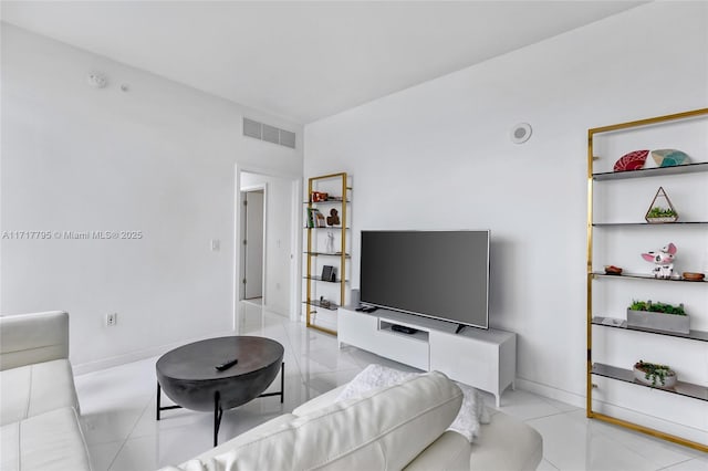 living room with visible vents and baseboards