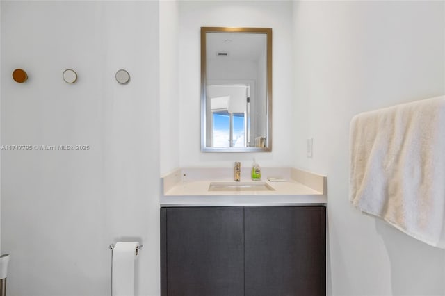 bathroom featuring radiator heating unit and vanity