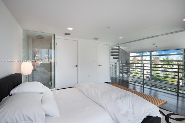 bedroom with dark hardwood / wood-style flooring