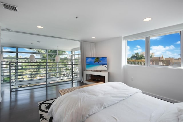 bedroom with dark wood-type flooring