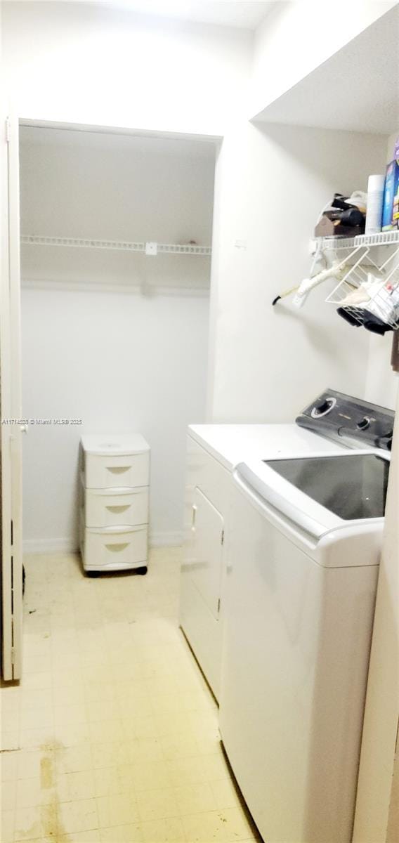 laundry area featuring washing machine and dryer