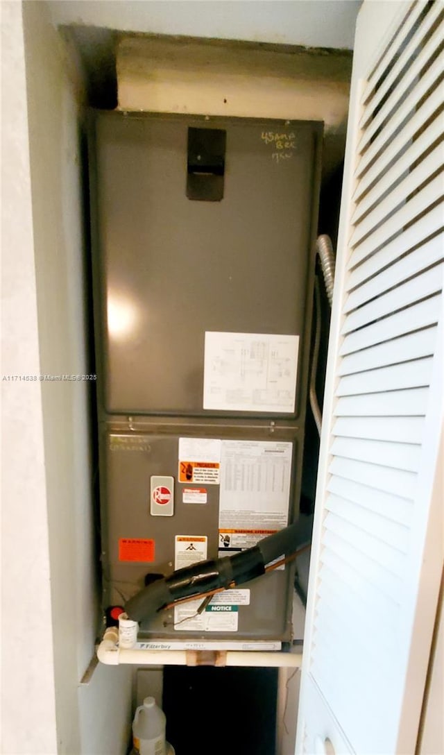 utility room with heating unit