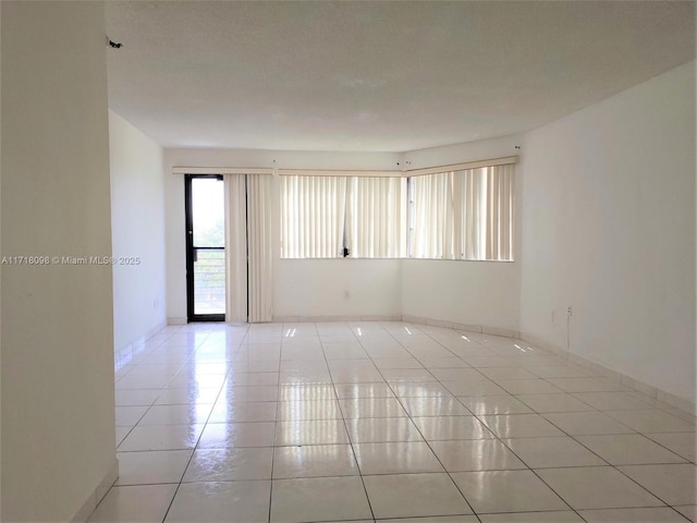 view of tiled spare room