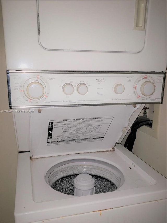 washroom with stacked washer and clothes dryer