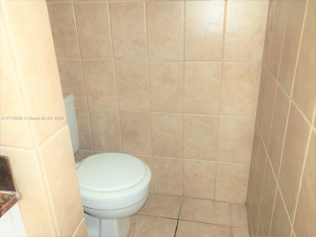 bathroom with tile patterned floors and toilet