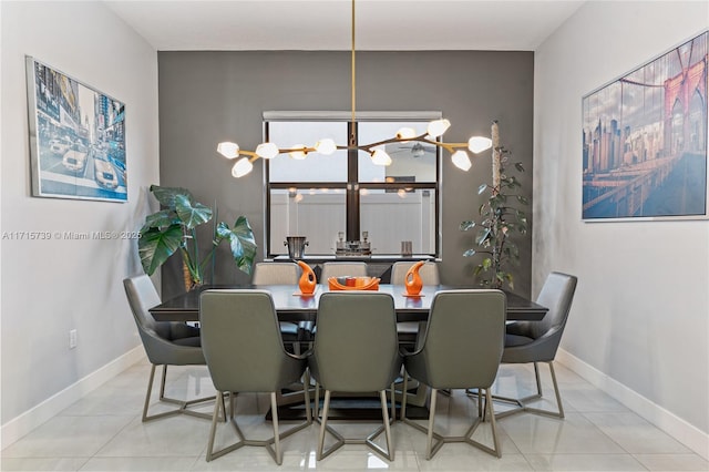 tiled dining area featuring a notable chandelier