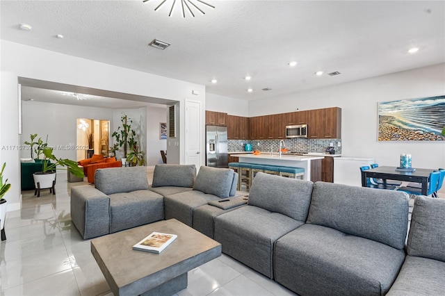 living room featuring a textured ceiling