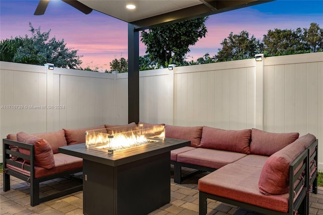 patio terrace at dusk with an outdoor fire pit