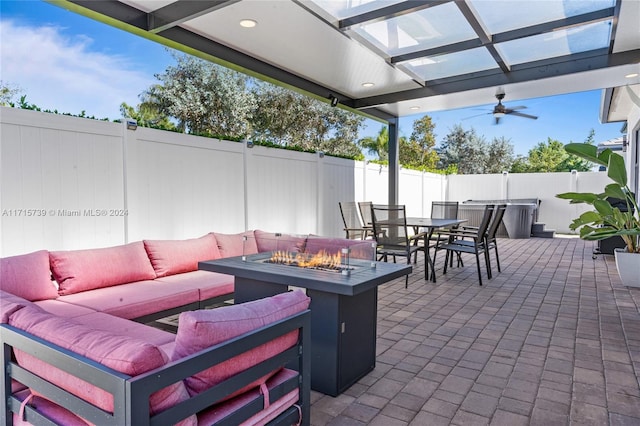 view of patio / terrace with an outdoor living space with a fire pit