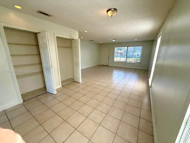 interior space featuring a textured ceiling