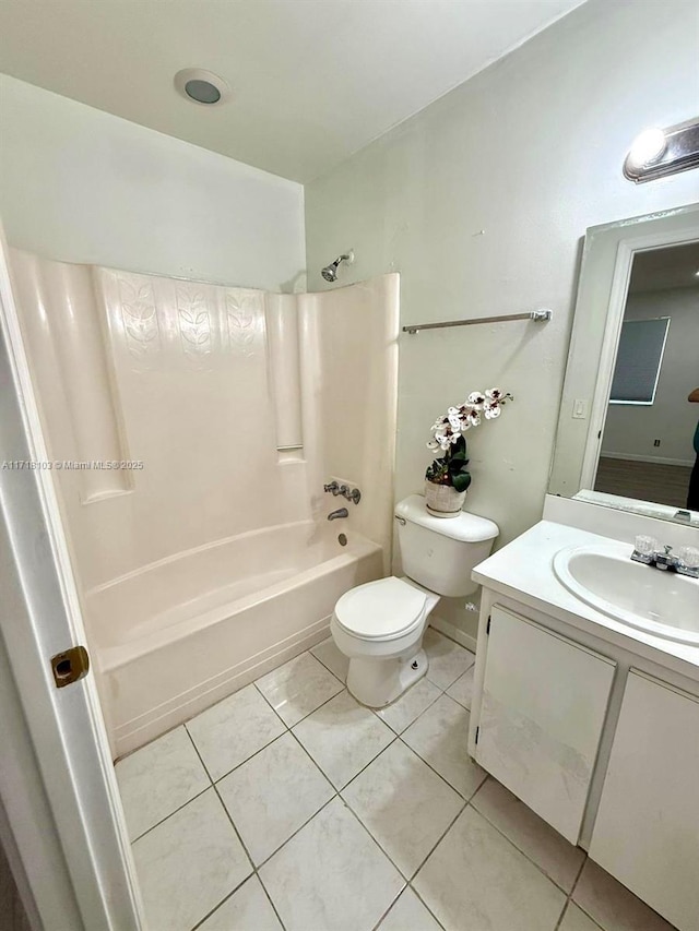 full bathroom featuring tile patterned floors, toilet, vanity, and tub / shower combination