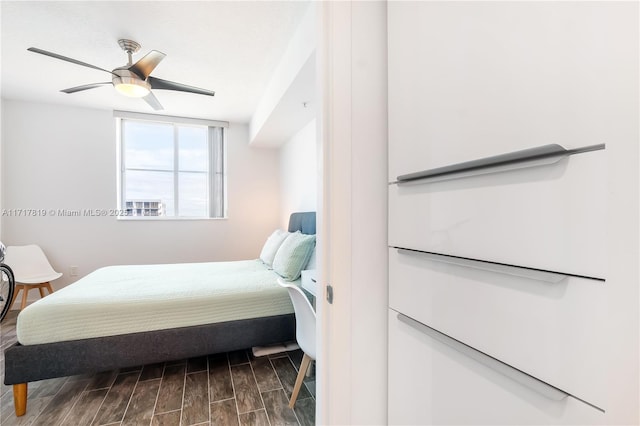 bedroom with wood finish floors and a ceiling fan